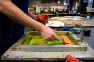 Close up image of paper screen printing process