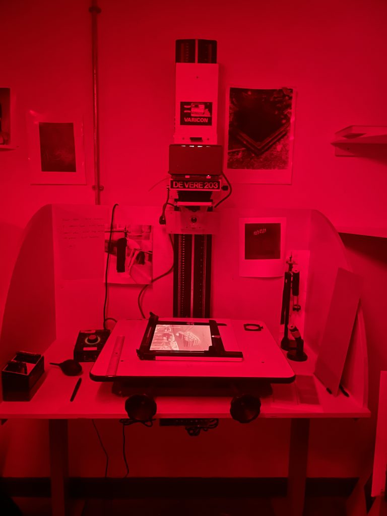 A photograph of an enlarger, in the darkroom used for printing photographs with Rhubarb