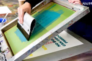 A close up image of screen printing in action.
