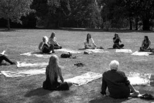 Emily Ryalls Divine Archives. Women gathered sat in a circle.