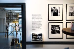 Framed black and white portraits by Emily Andersen displayed outside the gallery