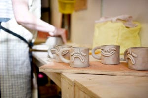 Sunshine Child Smiley and Sad face mugs